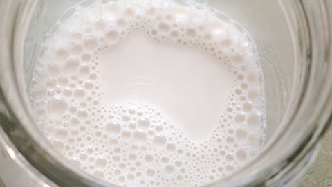 raw nut milk in glass jar