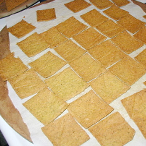 cheesy crackers on parchment paper