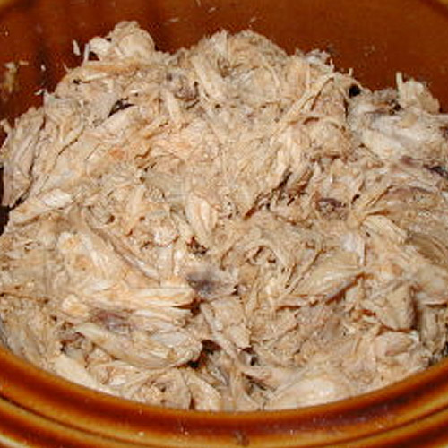 shredded chicken in a crock