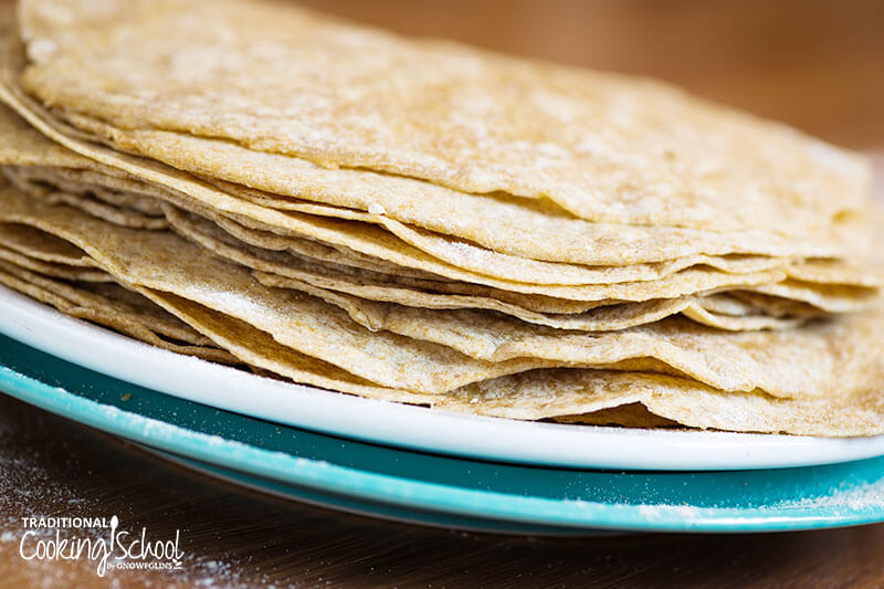 How To Make Sourdough Tortillas {with whole wheat flour!} | Oh, yumm... These sourdough tortillas with whole wheat flour were awesome! Chewy, soft, and pliable! The second day, I heated them up in a warm skillet, one by one, where they retained all their first day softness. | TraditionalCookingSchool.com
