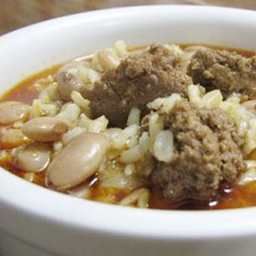 White bowl with hamburger and bean chili