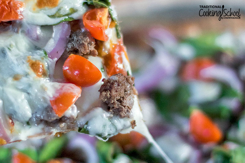 Slice of cheesy pizza.