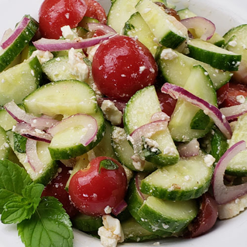 Mediterranean Cucumber-Tomato-Mint Salad | When the cucumbers and tomatoes are in season, I go a little crazy. Can you blame me? We eat 1 of 3 cucumber and/or tomato salads just about every day. Here's one of my favorites! | TraditionalCookingSchool.com