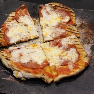 Grilled Pizza | You'll love amazing brick oven-crispy-chewy, full-flavored pizza -- and you'll appreciate not heating up the kitchen in the summer. With these techniques, your grill, and my special Italian pizza dough and sauce recipes (some of which I learned while in Italy), expect to be transported across the sea to Naples, the birthplace of pizza. | GNOWFGLINS.com