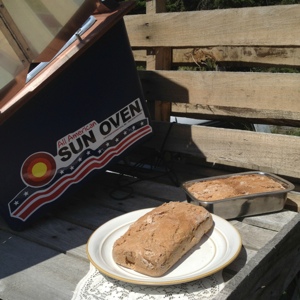 Homemade Bread in the Sun Oven | Baking bread in a sun oven is so easy -- it yields bread with a nicely browned crust and a moist, soft inside, plus keeps your house from getting too warm in the summer and saves electricity. Plus, you get to pull up a chair and read a bit while it bakes! | GNOWFGLINS.com