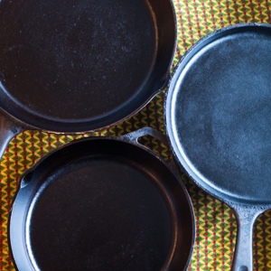 Why We Love Cast Iron | My husband asked about the black specks in the mashed potatoes. "Oh, that's just my frying pan. The non-stick coating is wearing away." Then he brought home a box of old cast iron pans from a garage sale. I ignored them as long as I could, but now? I'm the biggest fan ever -- here's why we love cast iron. | GNOWFGLINS.com