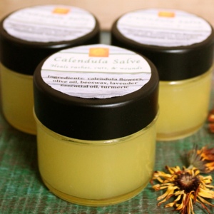 Make Your Own Calendula Salve | Calendula is a wonderful healing herb -- excellent for all skin ailments, quickly healing rashes and wounds, and gentle for the whole family. Make up a batch of this salve in 15 minutes and have a go-to remedy for all rashes, cuts, scrapes, bruises, burns, bites, blisters, and dry skin. Pour it into a pretty jar, top it with a label and ribbon, and it makes a thoughtful gift! | TraditionalCookingSchool.com