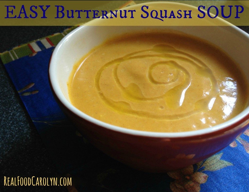 orange colored butternut squash soup garnished with a drizzle of oil