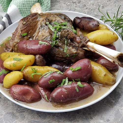 lamb roast sprinkled with spices and potatoes