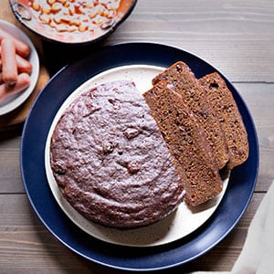 Made from the whole grains that were prevalent in colonial times, Boston brown bread is a New England staple that's sadly fading from American tradition. This version is leavened with sourdough starter and steamed in the Instant Pot!