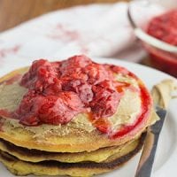 When wheat made our guts unhappy and syrup fed harmful candida, Saturday mornings were suddenly depressing. Well, no more! We happily enjoy THESE grain-free pancakes made with coconut flour and topped with strawberries!