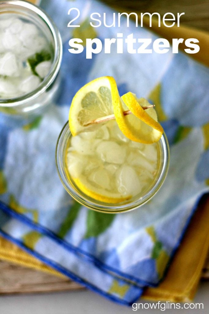 Summer spritzers with lemon twist on blue napkin with white overlay