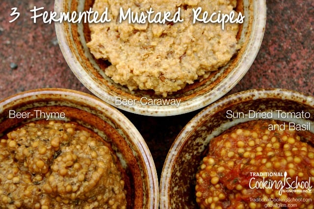 Three bowls of fermented mustard in earthen bowls on the counter with white text overlay
