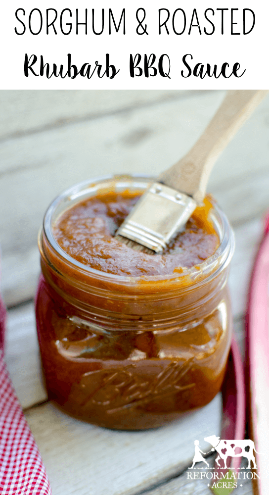 Sorghum and Rhubarb Barbecue Sauce in jar with brush on wooden table with black text overlay