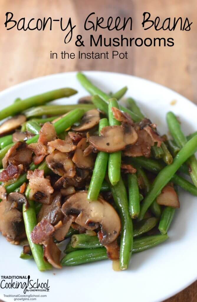 green beans with mushrooms and bacon on white plate