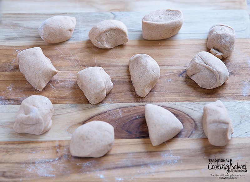 Sourdough flatbread dough divided up into 12 equal portions.