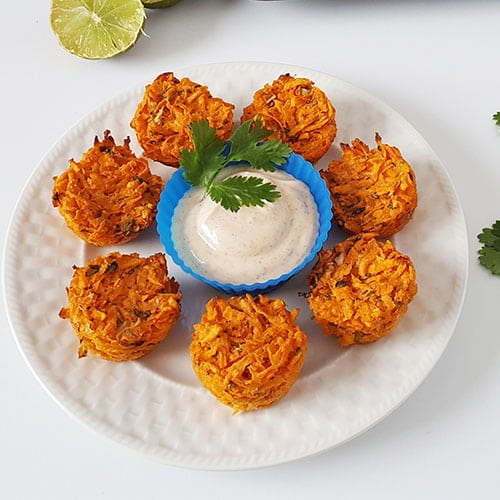 Is there any way to make tater tots good for you? With these grain-free Garlic-Lime Mini Sweet Potato Puffs, the answer is YES! These make an easy and nourishing appetizer, side dish, or snack, and the chili-yogurt dipping sauce is a delicious way to get extra probiotics into your meal.