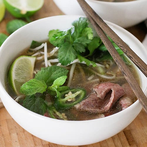 instant pot gaps diet beef pho in white bowl with fresh cilantro
