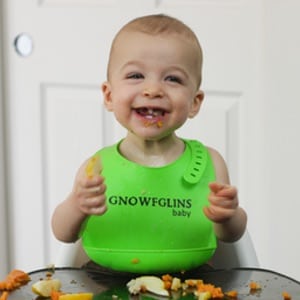 happy gnowfglins baby eating nourishing solid foods