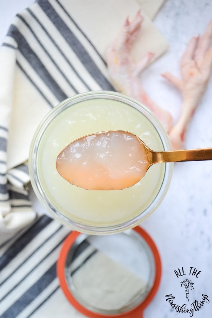 jiggly instant pot chicken foot broth on gold spoon