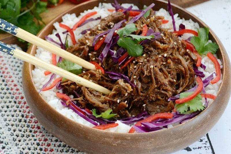 sweet and spicy asian pulled pork over a bed of white rice