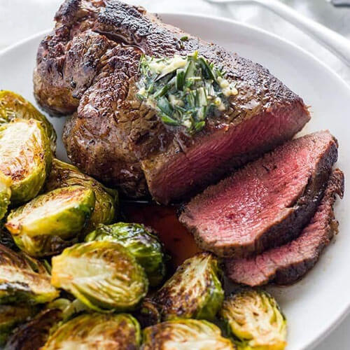 a romantic dinner of rare steak and brussels sprouts