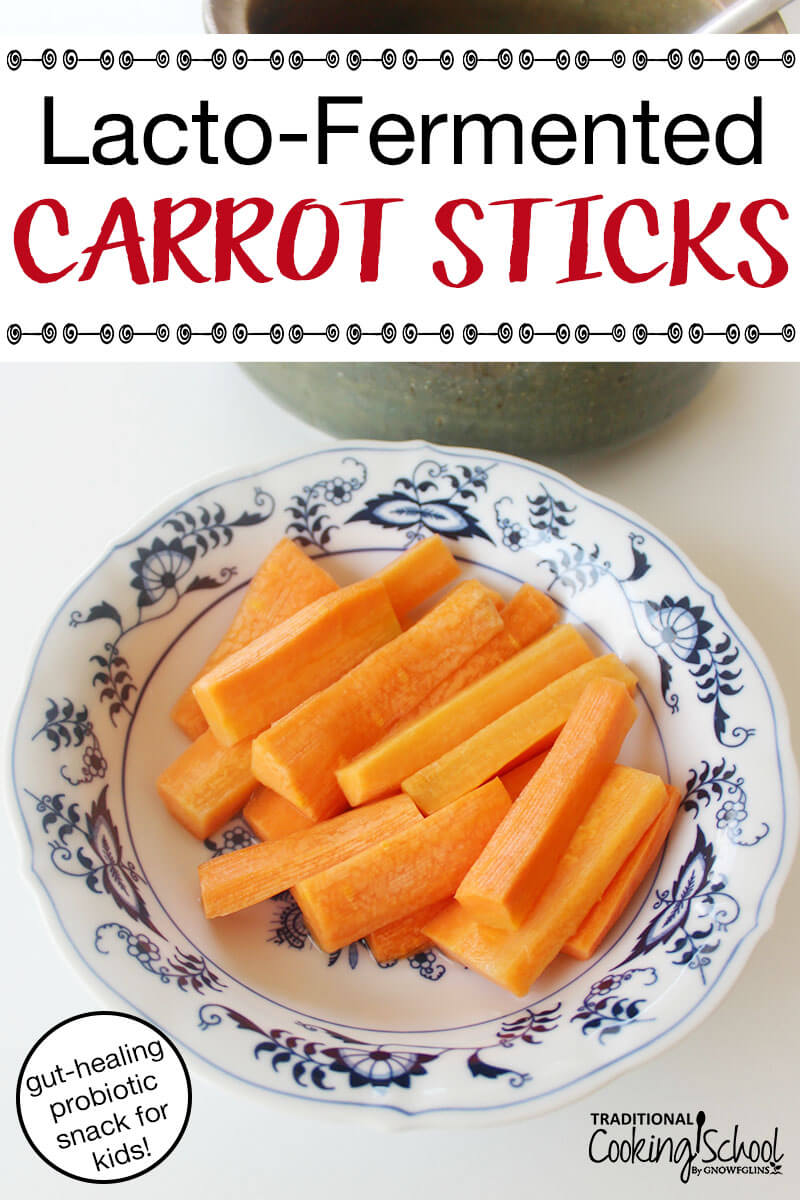a bowl of carrot sticks next to a crock where fermentation will occur with the addition of sea salt and water; with text overlay: "Lacto-Fermented Carrot Sticks (gut-healing probiotic snack for kids!)"