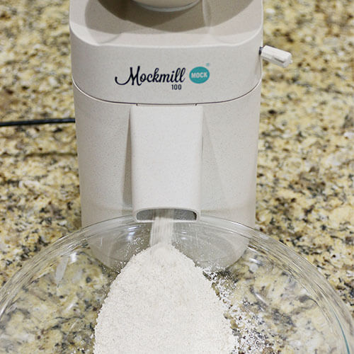 Mockmill home grain mill grinding soft wheat berries into homemade pastry flour