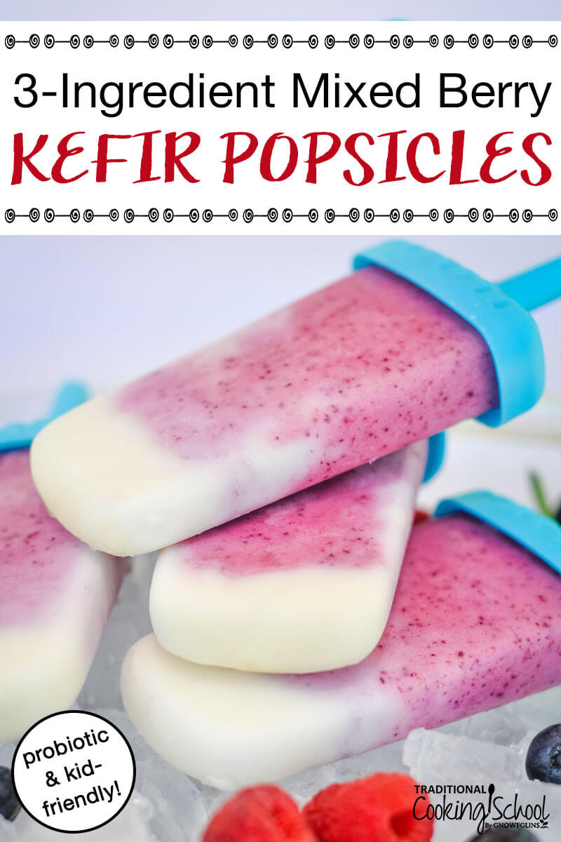 stack of beautiful healthy pink and white fruit popsicles in blue molds, with text overlay: "3-Ingredient Mixed Berry Kefir Popsicles (probiotics & kid-friendly!)"