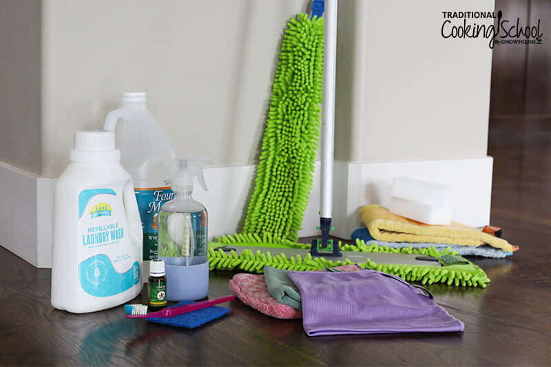 array of nontoxic cleaners, including laundry detergent, Norwex products like the dusting wand, mop, and cloths, essential oils, and more