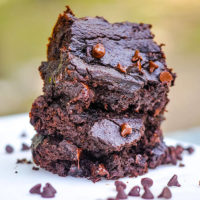 stack of gooey gluten-free brownies sprinkled with slightly melty mini chocolate chips