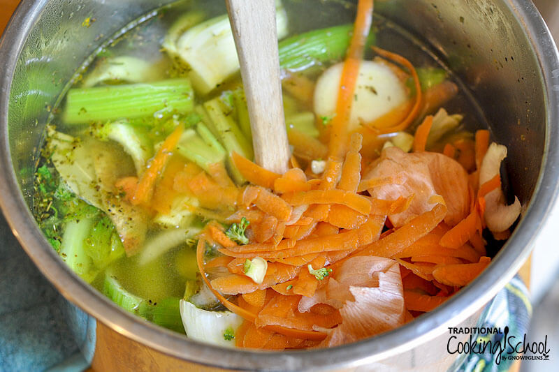 making vegetable stock with sauteed vegetables and veggie scraps, added to the Instant Pot with water