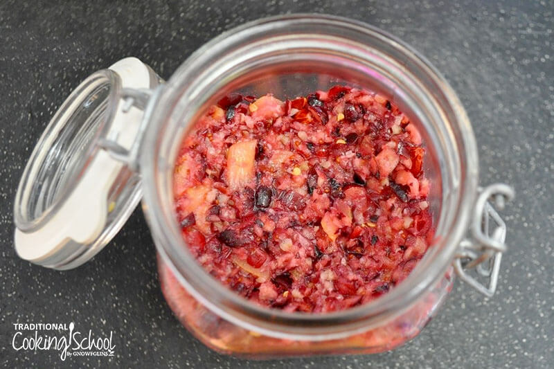 fermented apple cranberry relish in a small glass jar