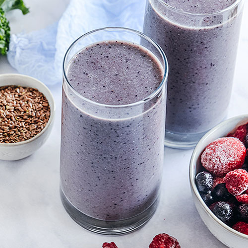 glasses of purple smoothie for ovulation support and hormone balance