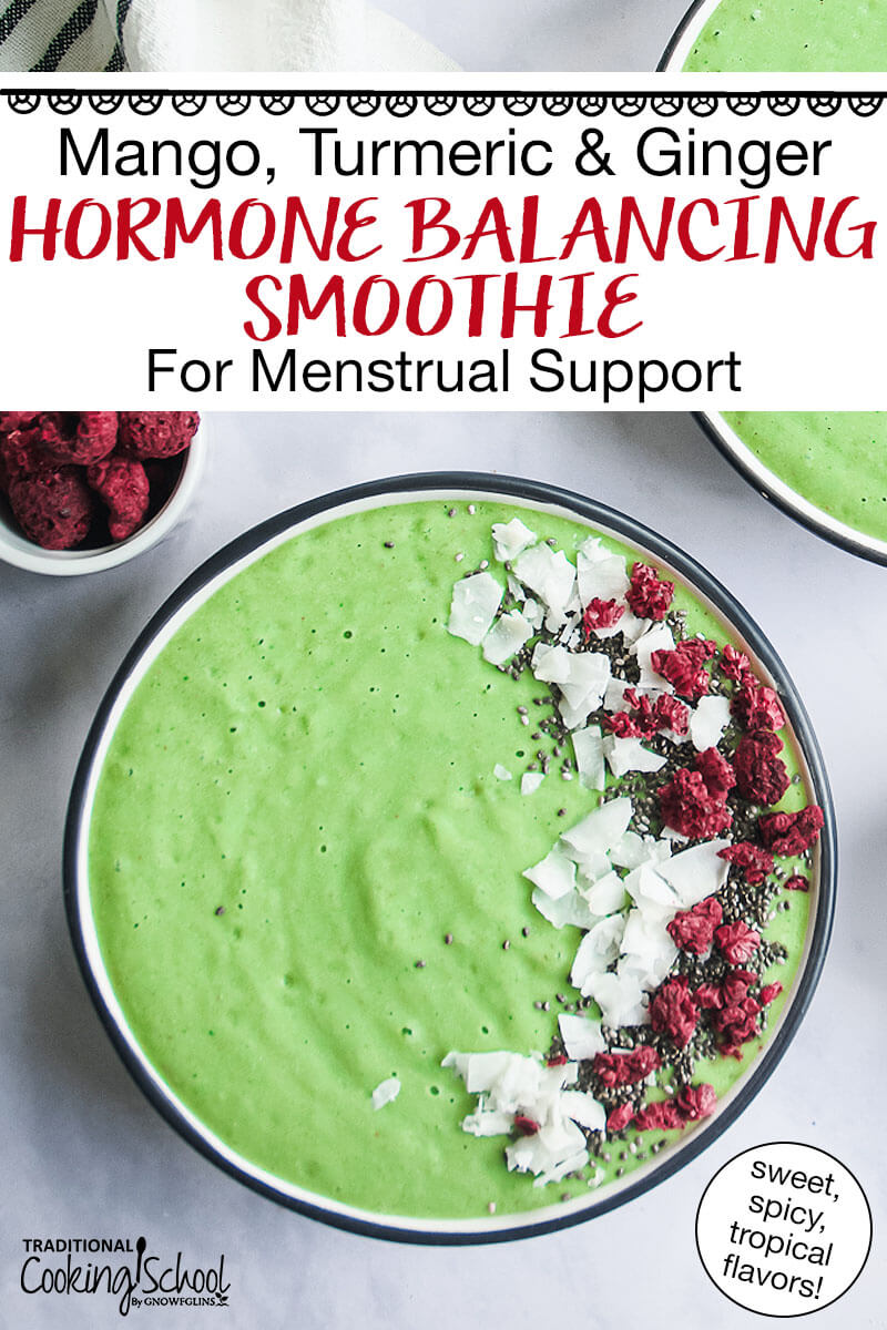 bright green smoothie bowl garnished with coconut, freeze-dried raspberries, and chia seeds. Text overlay says: "Mango, Turmeric & Ginger Hormone Balancing Smoothie For Menstrual Support (spicy, sweet, tropical flavors!)"