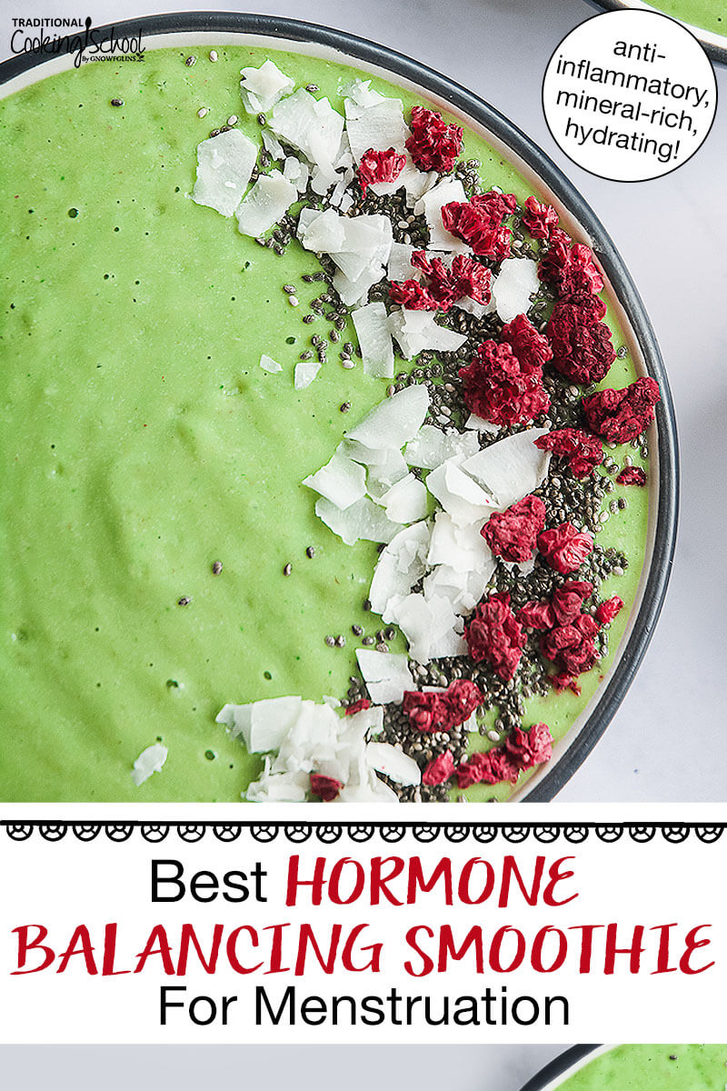 bright green smoothie bowl garnished with coconut, freeze-dried raspberries, and chia seeds. Text overlay says: "Best Hormone Balancing Smoothie For Menstruation (anti-inflammatory, mineral-rich, hydrating!)"
