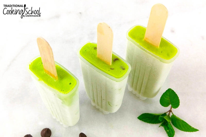 three mint popsicles in popsicle molds