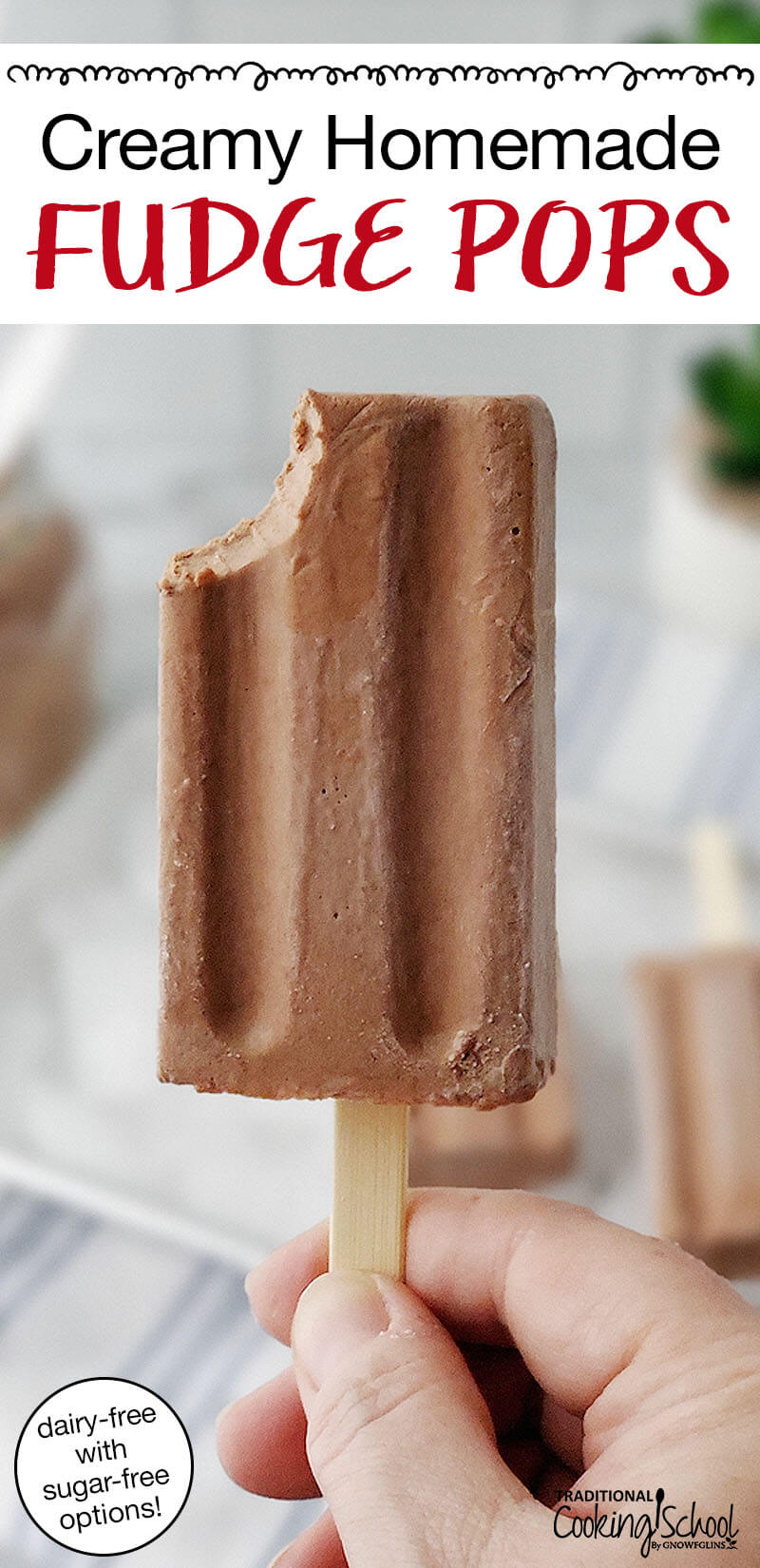 hand holding up a chocolate popsicle with a bite taken out of it. Text overlay says: "Creamy Homemade Fudge Pops (dairy-free with sugar-free options!)"