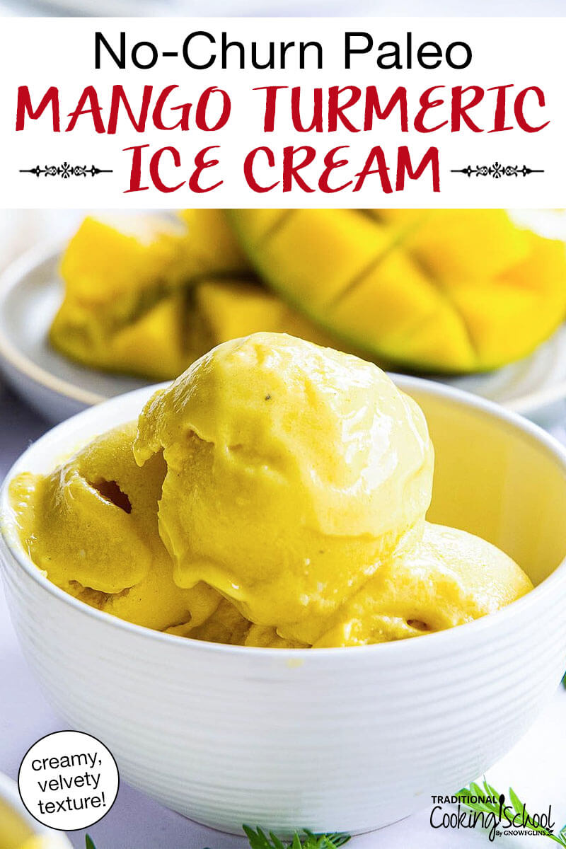 scoops of bright yellow ice cream in a white ceramic bowl with fresh mango in the background. Text overlay says: "No-Churn Paleo Mango Turmeric Ice Cream (creamy, velvety texture!)"