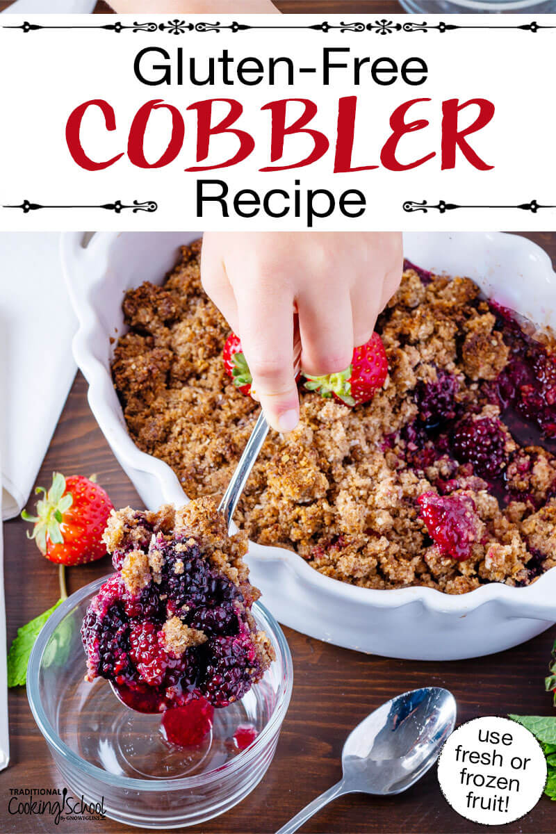 Scooping into a cobbler garnished with fresh strawberries, in a white casserole dish with scalloped edges. Text overlay says: "Gluten-Free Cobbler Recipe (use fresh or frozen fruit!)"
