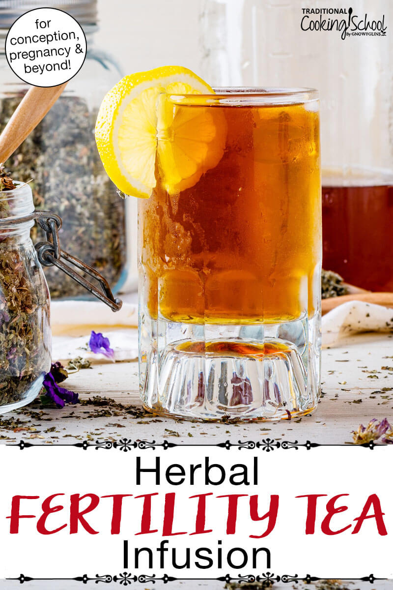 Amber-colored cold herbal infusion with a lemon slice. Text overlay says: "Herbal Fertility Tea Infusion (for conception, pregnancy & beyond!)"