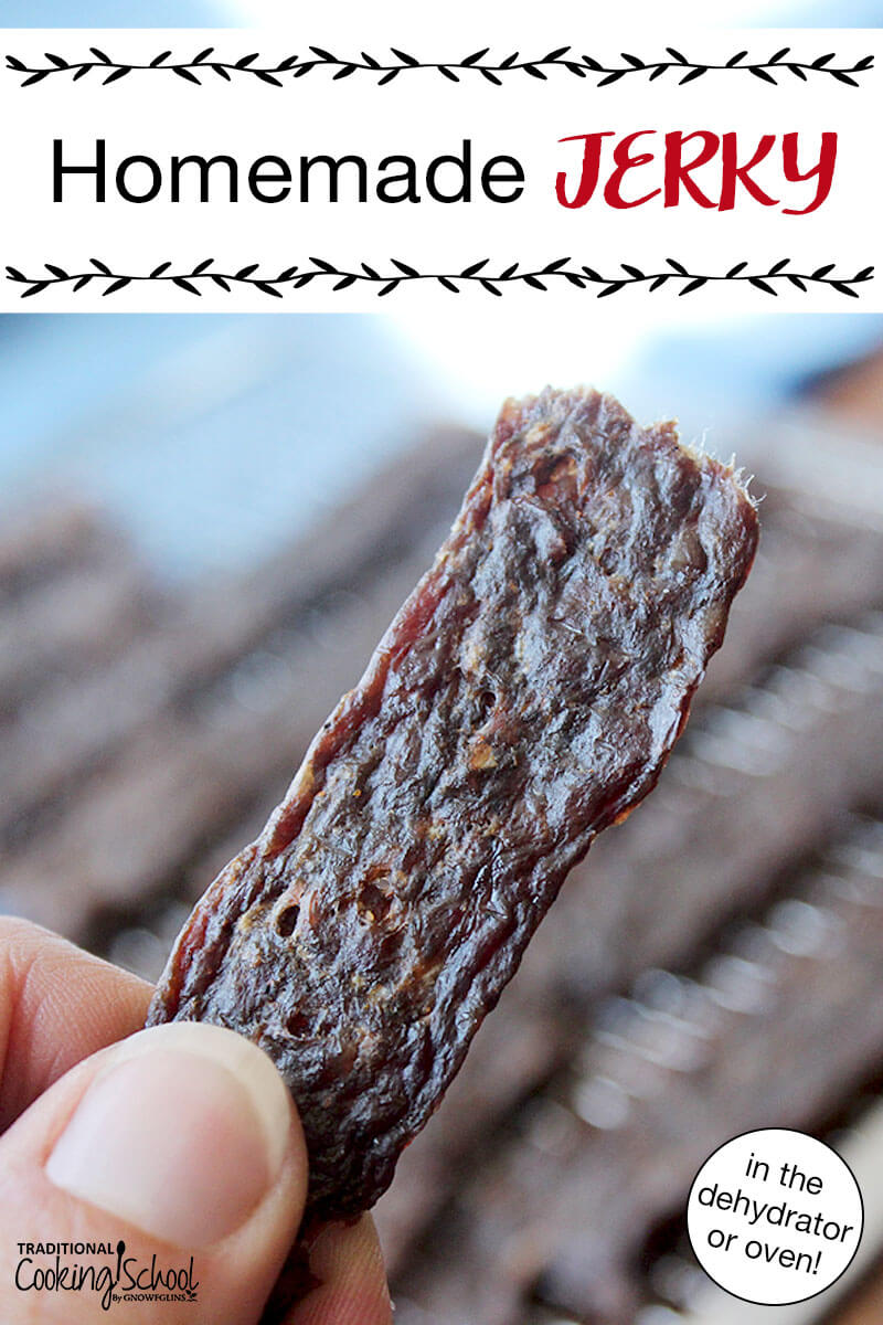 Woman's hand holding up a strip of jerky. Text overlay says: "Homemade Jerky (in the dehydrator or oven!)"