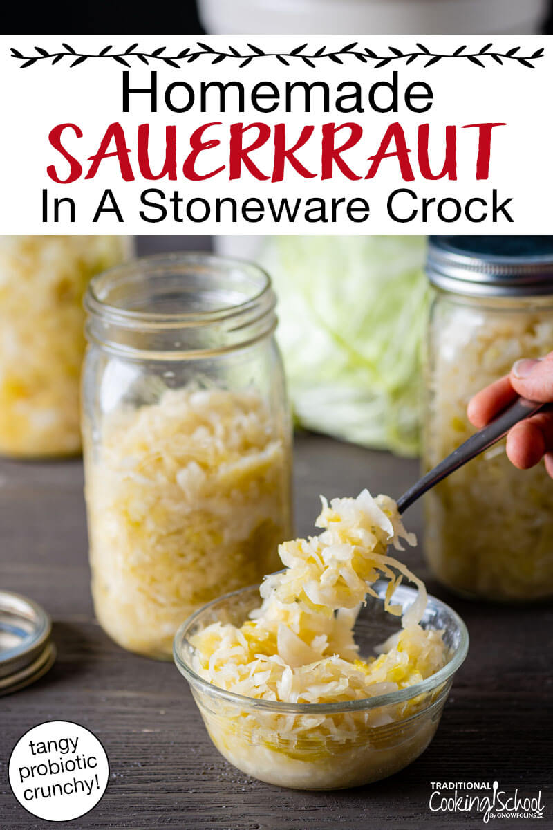 Scooping up a bite of homemade sauerkraut out of a small dish. Text overlay says: "Homemade Sauerkraut In A Stoneware Crock (tangy, probiotic, crunchy)"