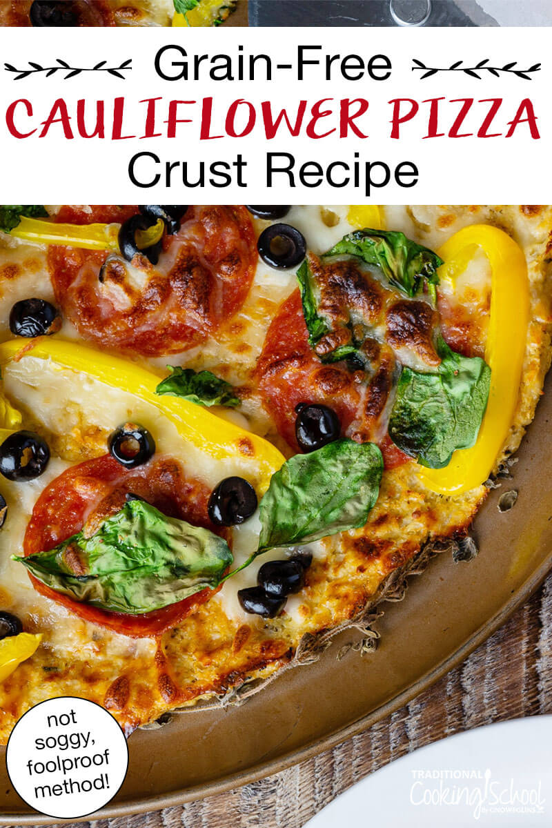 Close-up of cauliflower pizza topped with veggies, cheese, and meats baking in the oven. Text overlay says: "Grain-Free Cauliflower Pizza Crust Recipe (not soggy, foolproof method)"