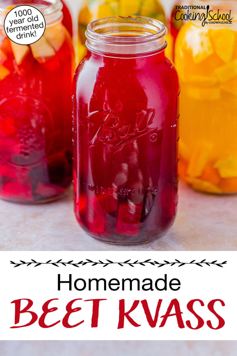 Ruby-colored beet kvass in a half gallon jar. Text overlay says: "Homemade Beet Kvass (1000 year old fermented drink!)"