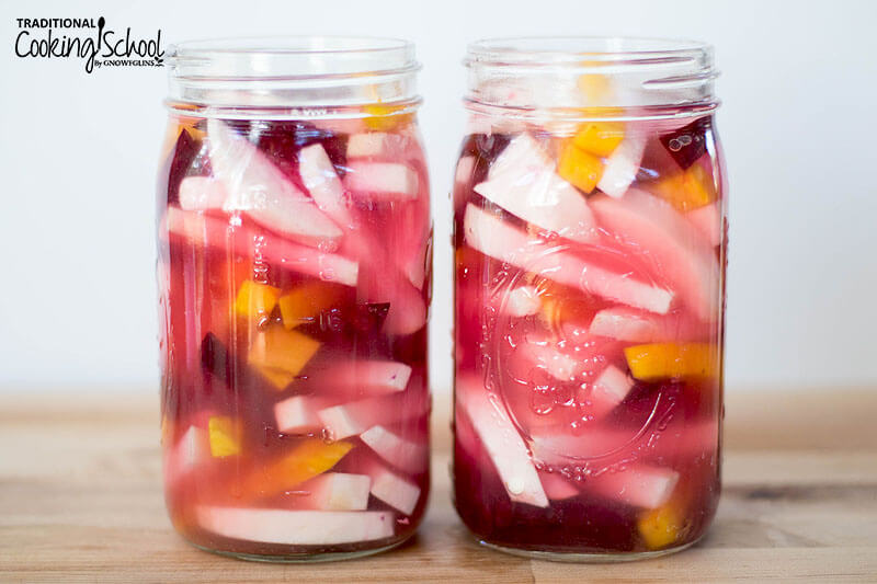 Photo collage of turnips, beets, and golden beets in quart-sized glass jars filled with brine, ready to be fermented.