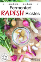 Quart sized jar of radish wedges and onion slices in a salt brine surrounded by fresh radishes on a wooden countertop. Text overlay says: "Fermented Radish Pickles (with only sea salt and water)"