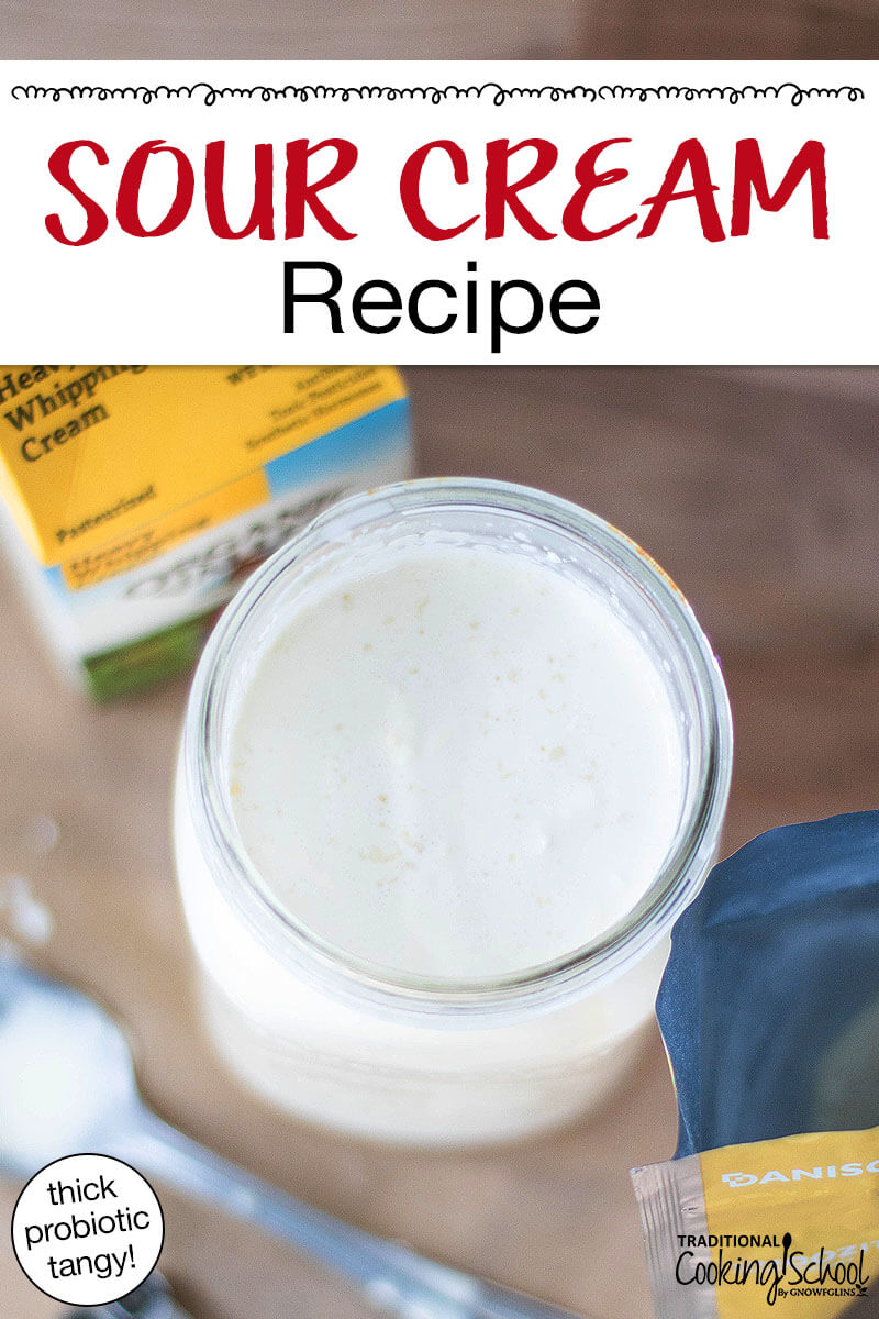 Cream in a quart-sized Mason jar with culture mixed in to make sour cream. Text overlay says: "Sour Cream Recipe (thick probiotic tangy)"