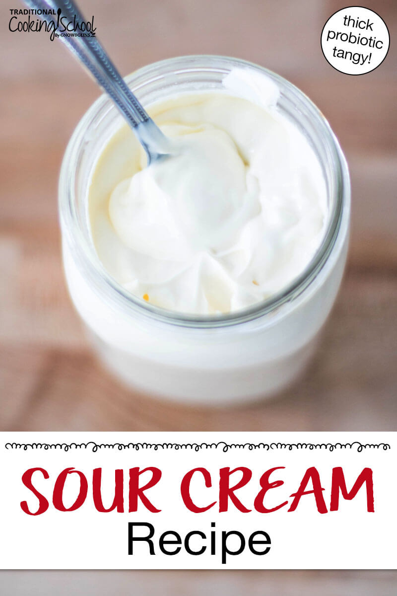 Thickened homemade sour cream in a glass jar. Text overlay says: "Sour Cream Recipe (thick probiotic tangy)"