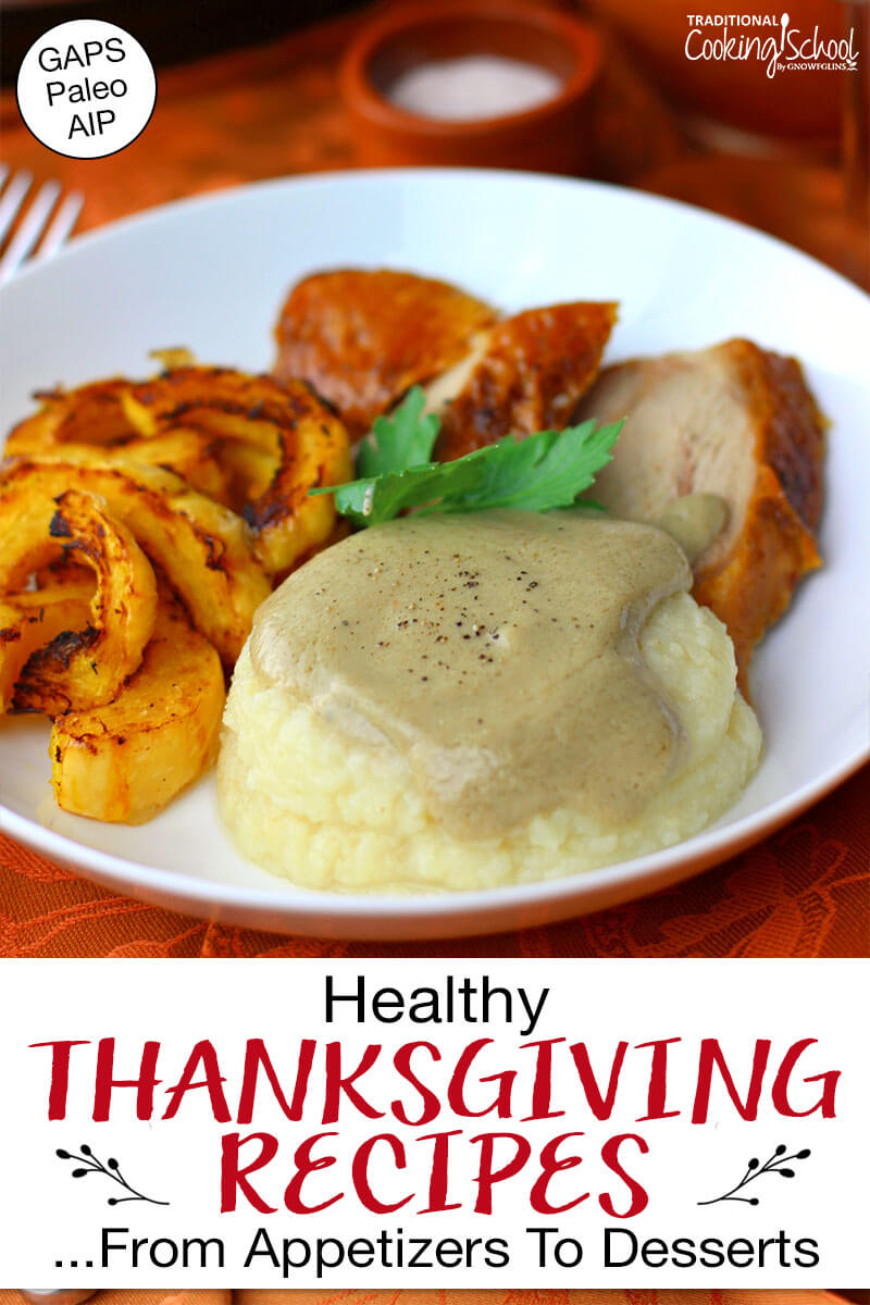 Allergy-friendly homemade gravy over mashed potatoes on a plate with sweet potatoes and sliced turkey. Text overlay says: "Healthy Thanksgiving Recipes ...From Appetizers to Desserts (GAPS Paleo AIP)"